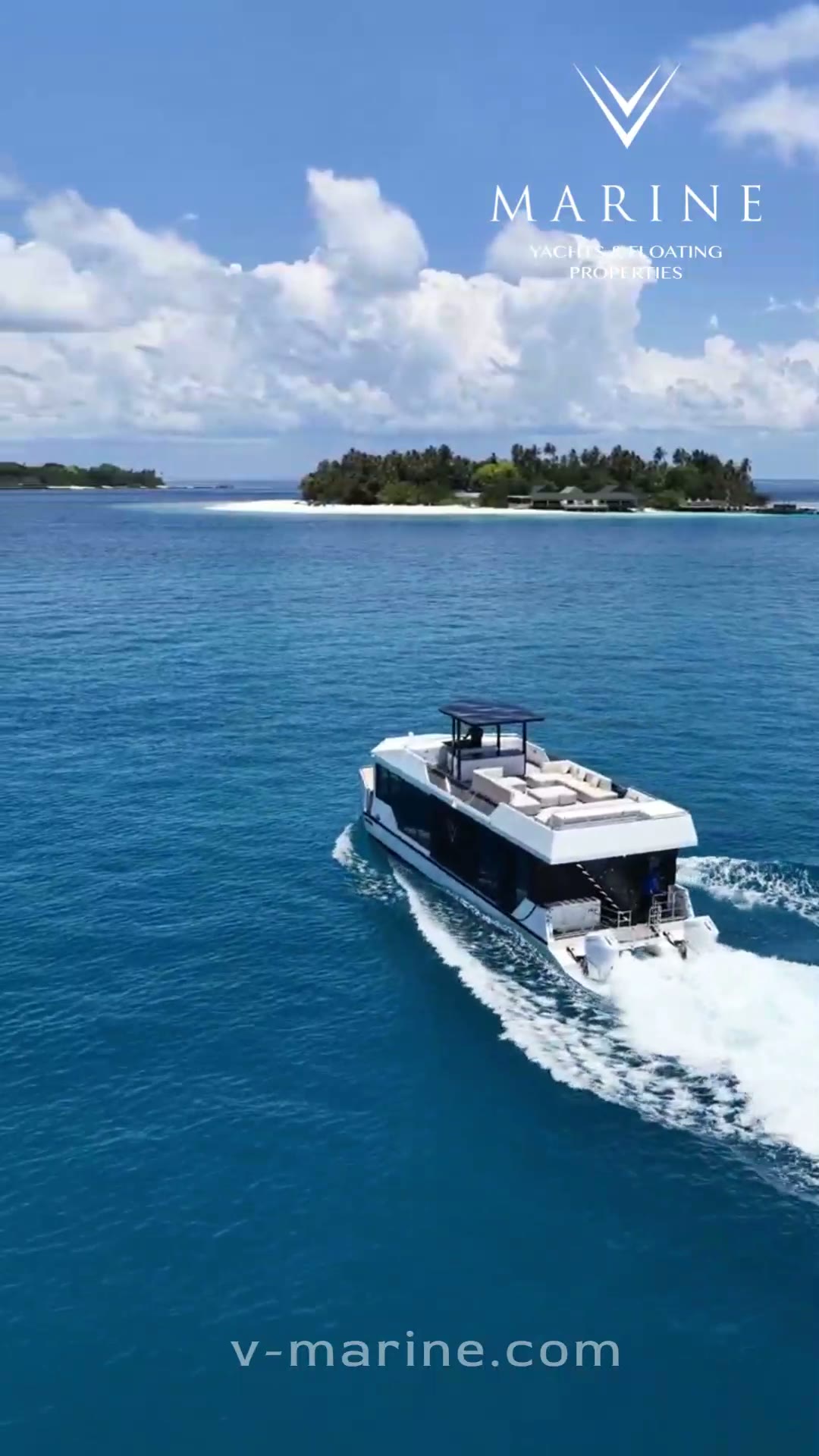 RISE 60 V-CAT catamaran cruising past a Maldivian island, seen from the air