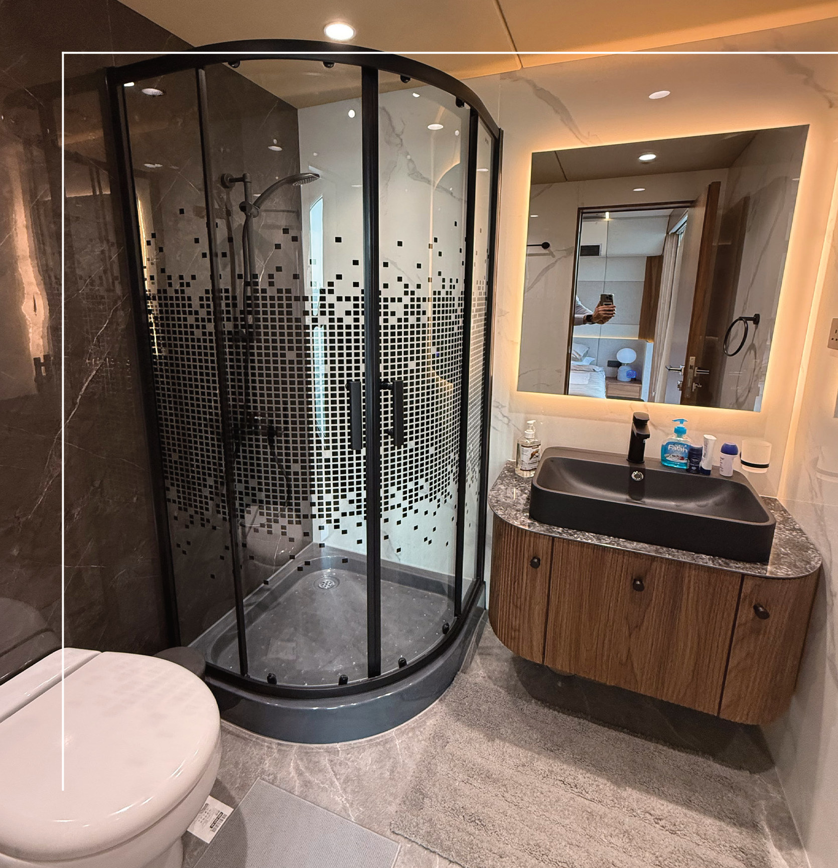 RISE 60 bathroom with glass shower enclosure, stone basin and walnut joinery
