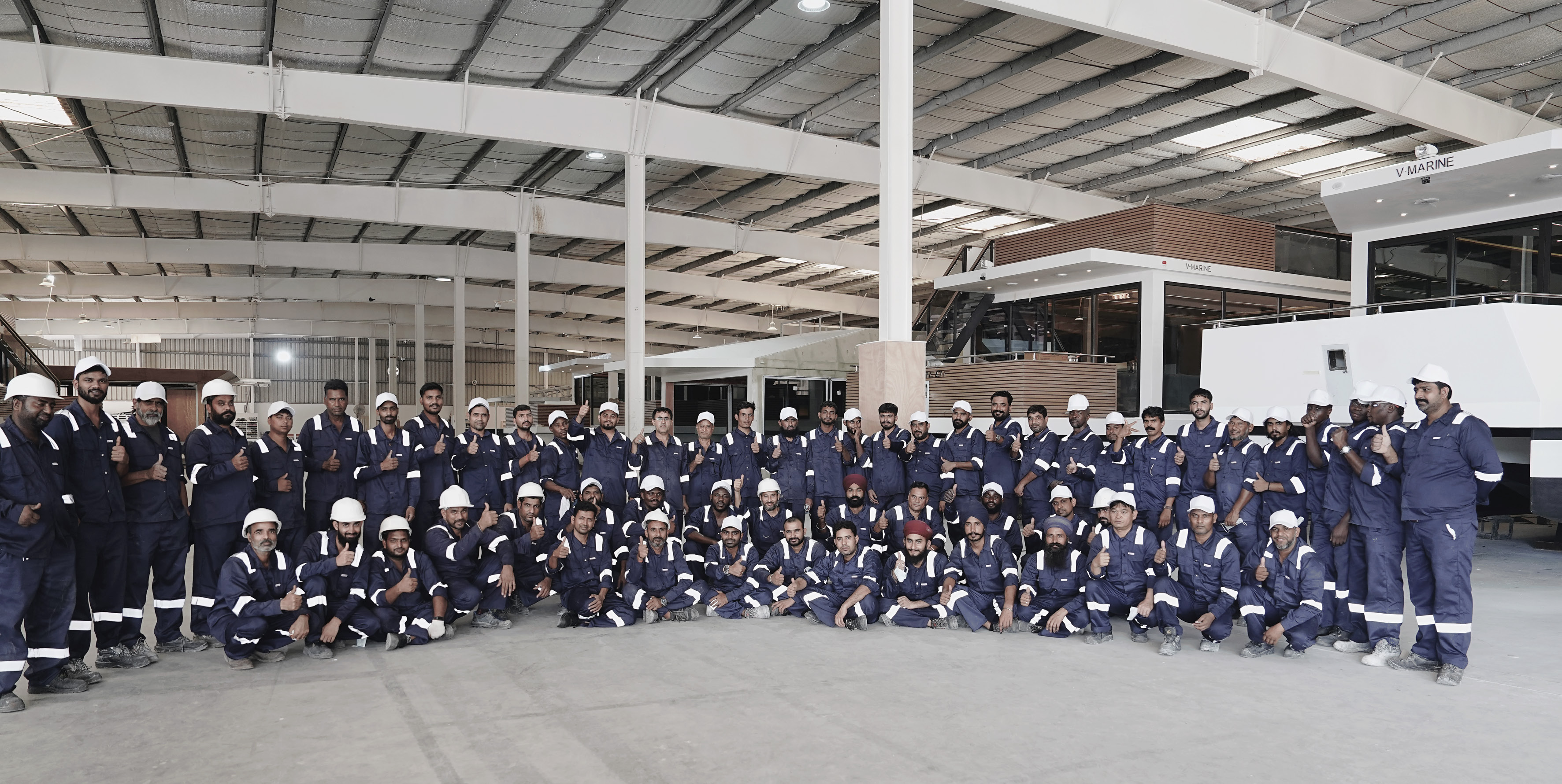 The full V-Marine team of 150 specialists gathered inside the Bahrain shipyard